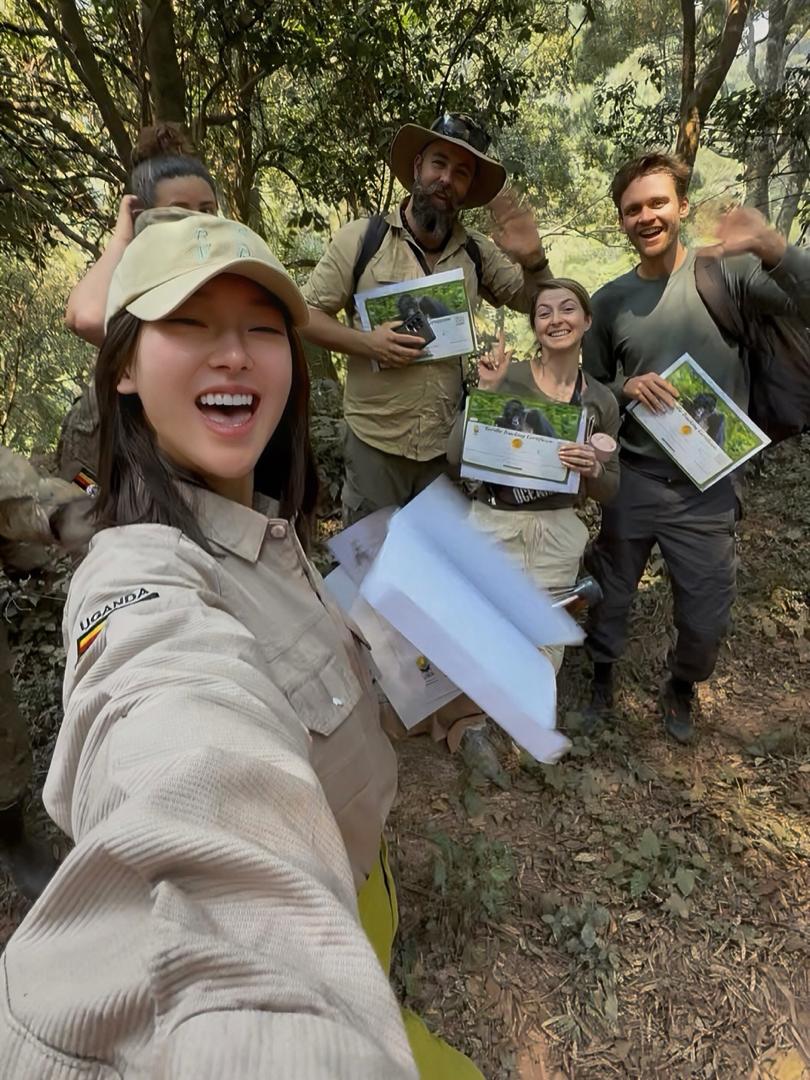 Safari guide leading gorilla trekking clients in Uganda