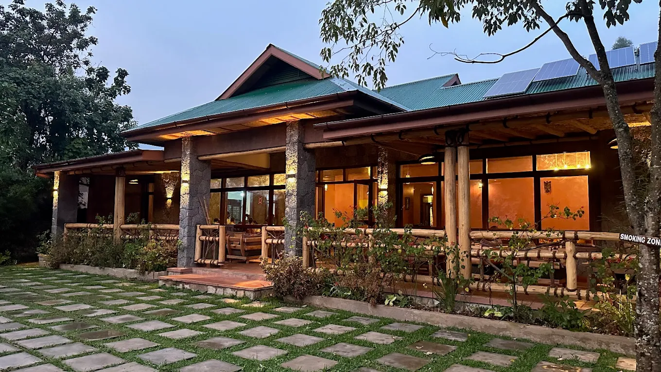 Outdoor lounge and surrounding forest at Ichumbi Gorilla Lodge