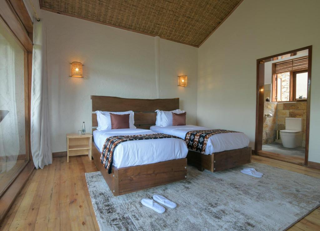 Beds inside Bwindi Panorama Resort room