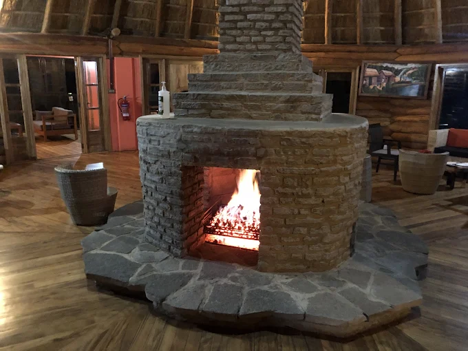 Outdoor fireplace at Trackers Safari Lodge