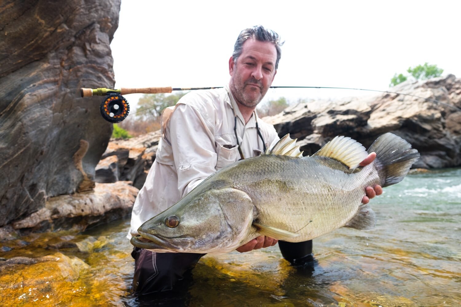 Tourists enjoying a fishing experience on a Ugandan lake