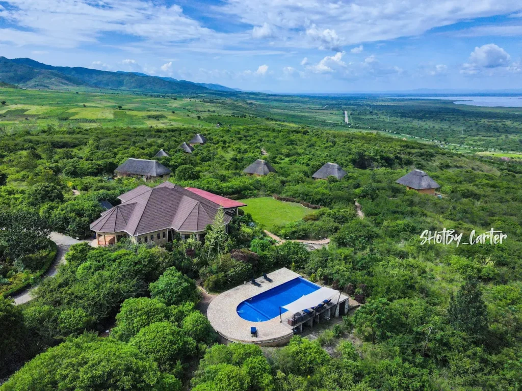 VElephant Plains Lodge offers another strong premium option around Queen Elizabeth National Park. The lodge sits high on the western escarpment of the Albertine Rift with broad views across