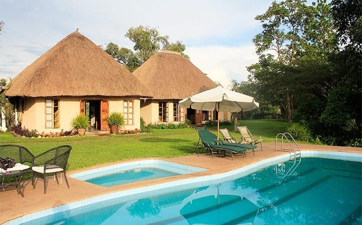 Perched on the rim of an ancient volcanic crater, Ndali Lodge offers one of the most
