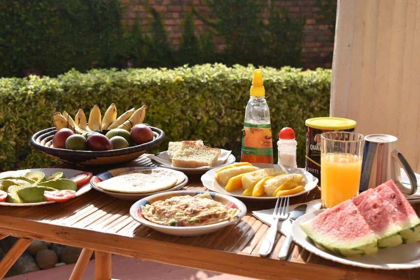 Breakfast dining and traditional Rwandan food at Amahoro Guest House