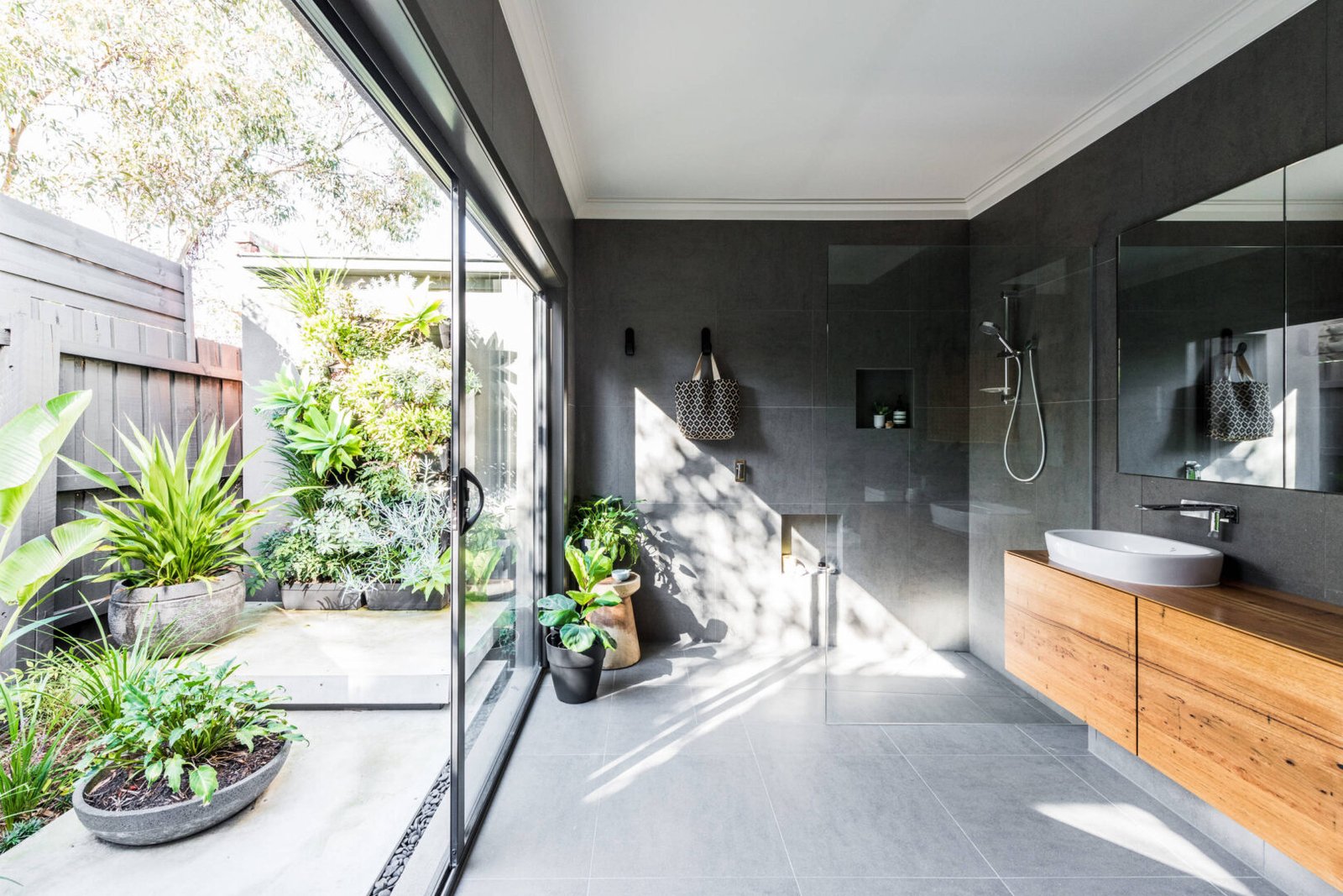 Modern en-suite bathroom and private outdoor shower at a luxury safari lodge